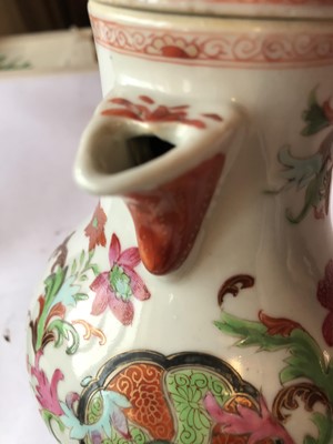 Lot 444 - A CHINESE FAMILLE ROSE PSEUDO-TOBACCO-LEAF JUG AND COVER.