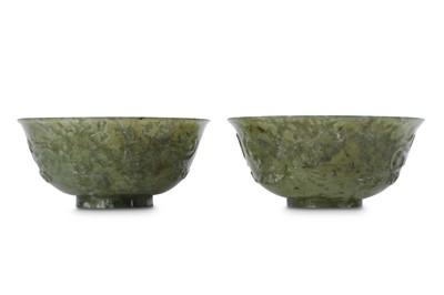 Lot 563 - A PAIR OF CHINESE SPINACH-GREEN JADE BOWLS.