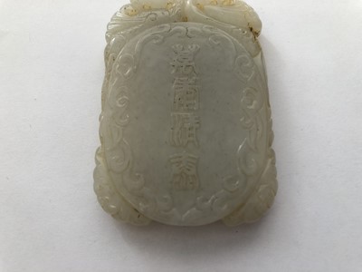 Lot 479 - A CHINESE WHITE JADE OVAL PLAQUE.