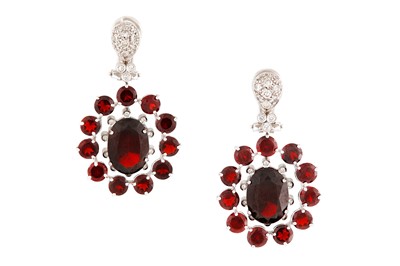 Lot 121 - A diamond and garnet ring and earrings suite