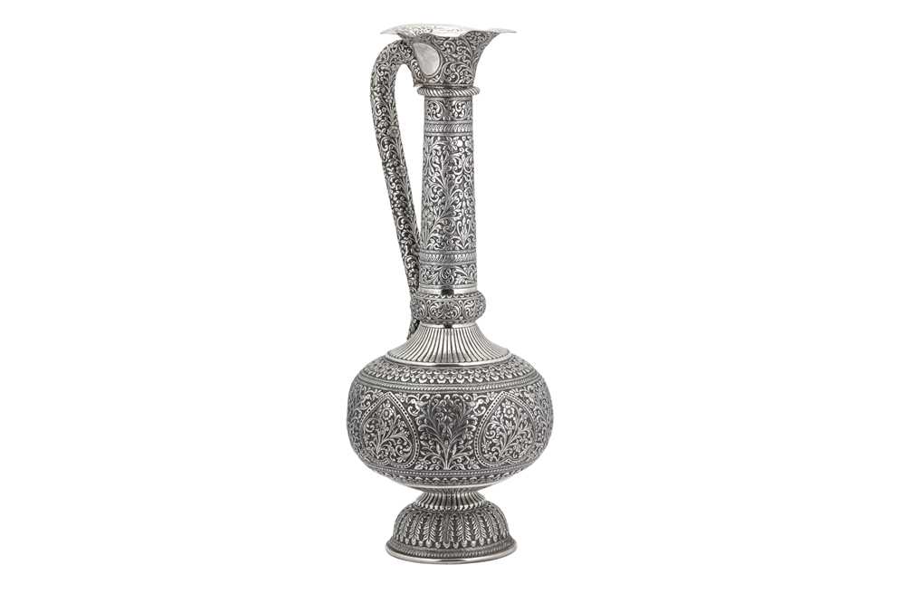 Lot 926 - A MONUMENTAL ANGLO-INDIAN UNMARKED SILVER WATER EWER (SURAHI)
