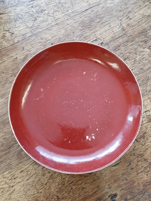Lot 84 - A CHINESE COPPER-RED ENAMELLED DISH.