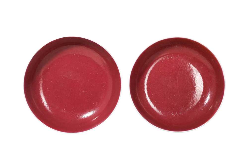 Lot 125 - A PAIR OF CHINESE COPPER RED GLAZED DISHES.