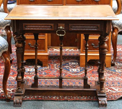 Lot 505 - A 19th Century walnut writing table with...