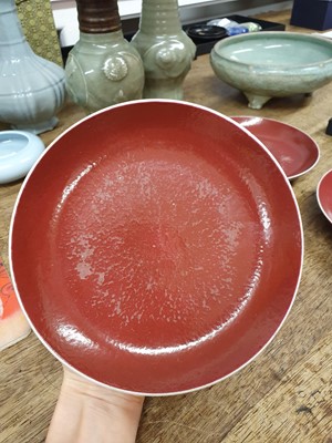 Lot 80 - A SET OF FOUR CHINESE COPPER RED-GLAZED DISHES.