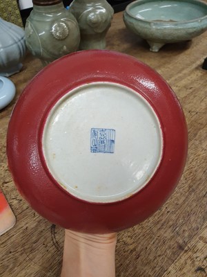 Lot 80 - A SET OF FOUR CHINESE COPPER RED-GLAZED DISHES.