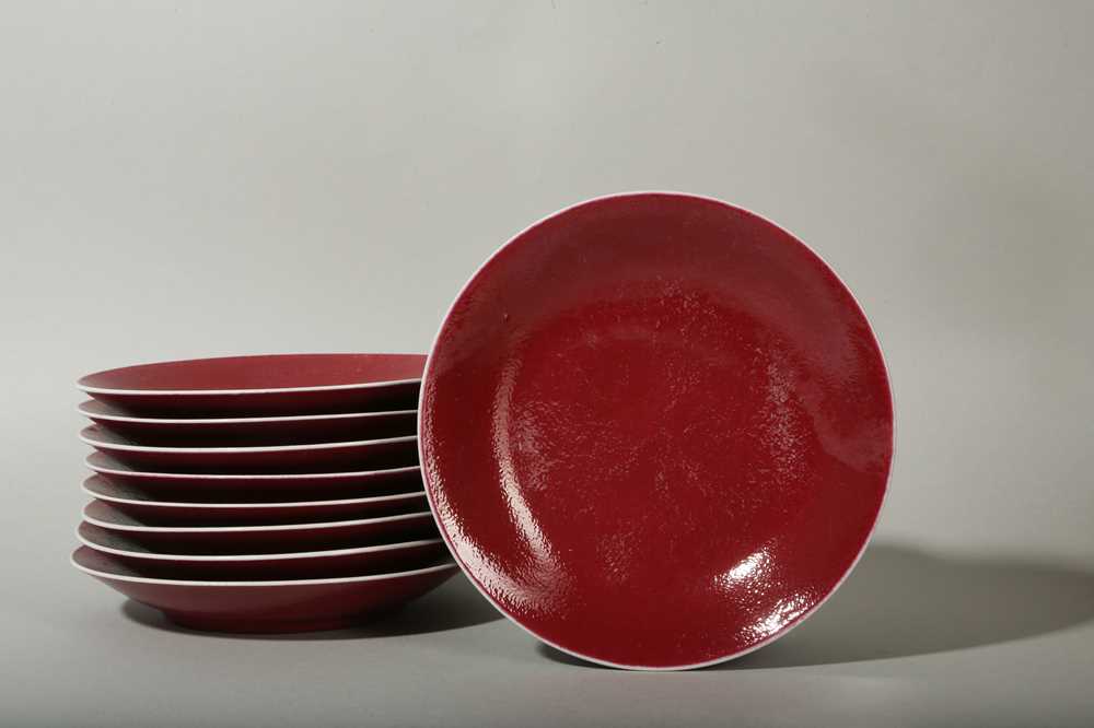 Lot 78 - A SET OF NINE CHINESE COPPER RED GLAZE DISHES.