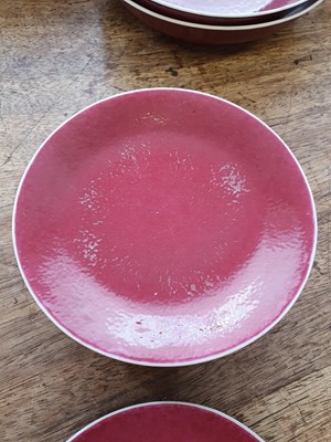 Lot 77 - A SET OF TEN CHINESE COPPER RED-GLAZED DISHES.