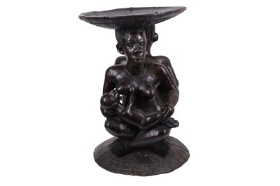 Lot 48 - A WEST AFRICAN TRIBAL CARVED HARDWOOD MATERNITY FIGURE STOOL / TABLE