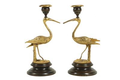 Lot 46 - A PAIR OF GILT AND PATINATED BRONZE STORK CANDLESTICKS IN THE MANNER OF THOMAS ABBOTT