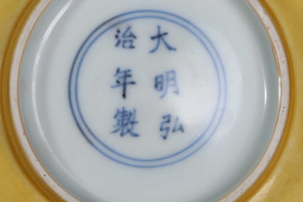 Lot 145 - A CHINESE YELLOW-GLAZED BOWL.