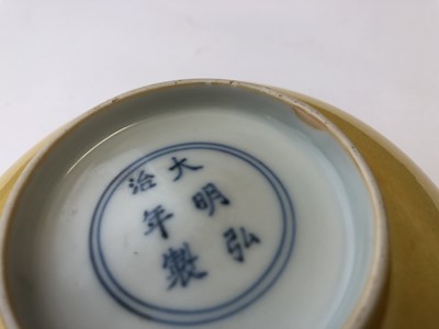 Lot 965 - A CHINESE YELLOW-GLAZED BOWL.