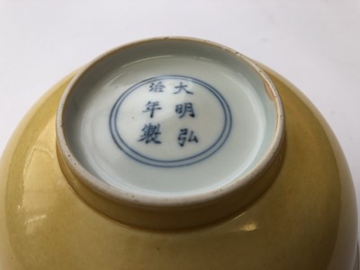 Lot 965 - A CHINESE YELLOW-GLAZED BOWL.