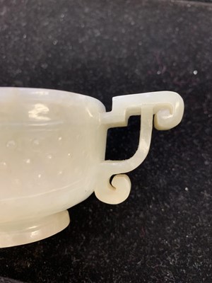 Lot 92 - A CHINESE PALE CELADON JADE CUP.
