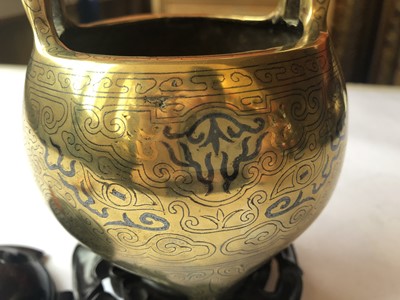 Lot 228 - A CHINESE GOLD AND SILVER-INLAID 'TAOTIE MASK' INCENSE BURNER.