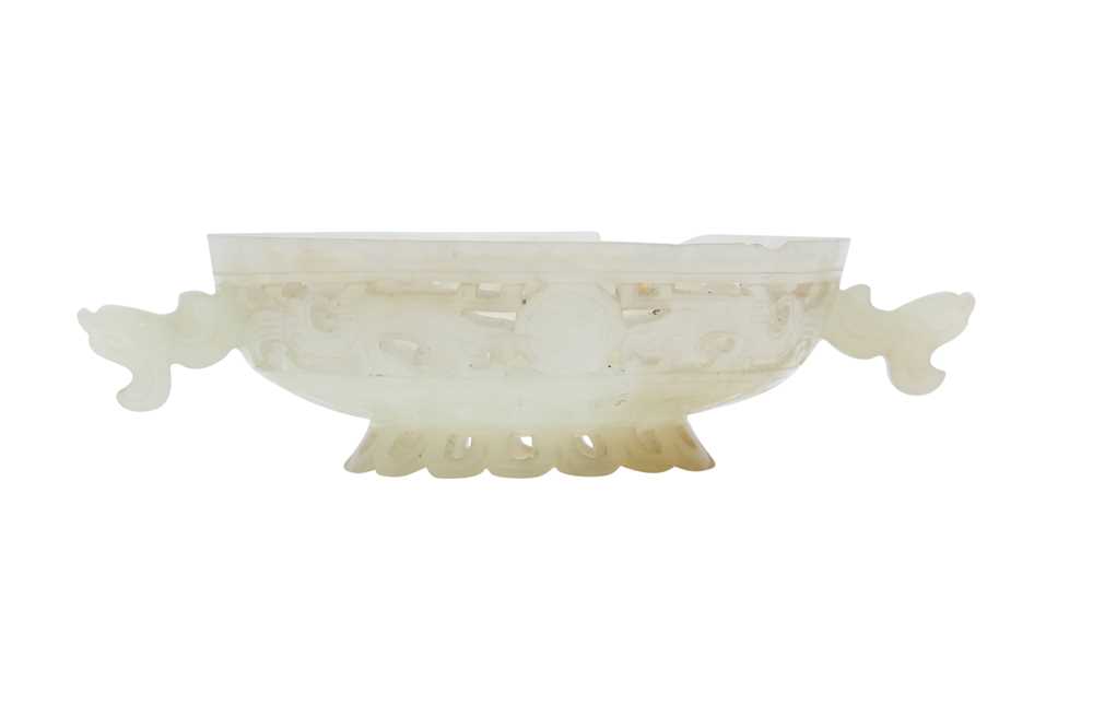 Lot 704 - A CHINESE WHITE JADE RETICULATED COVER.