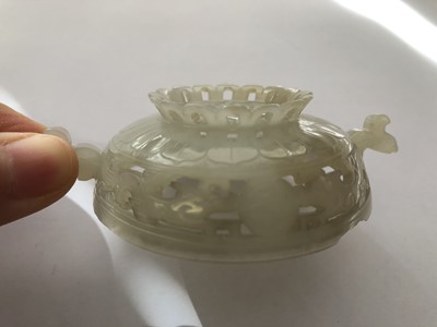 Lot 704 - A CHINESE WHITE JADE RETICULATED COVER.