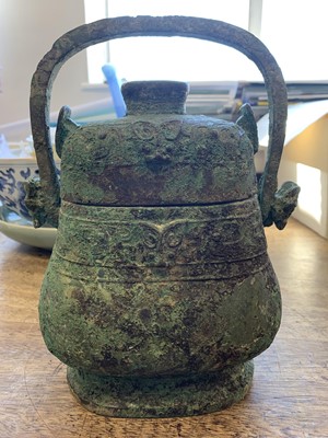 Lot 110 - A CHINESE BRONZE RITUAL VESSEL AND COVER, YOU.