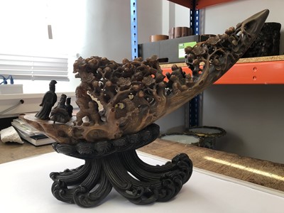 Lot 65 - λ A LARGE AND IMPRESSIVE CHINESE RHINOCEROS HORN 'IMMORTALS' RAFT' CARVING.