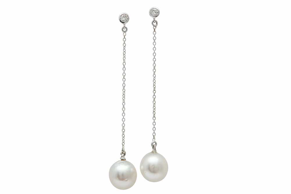Lot 1296 - A pair cultured pearl and diamond pendent earrings