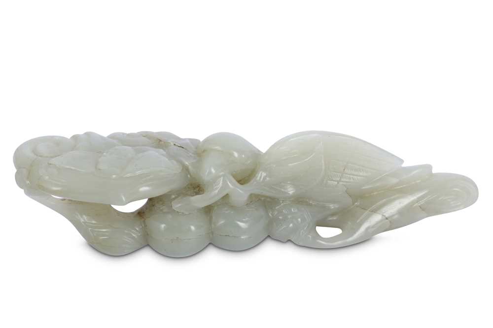 Lot 703 - A CHINESE PALE CELADON JADE 'BIRD AND LINGZHI' CARVING.