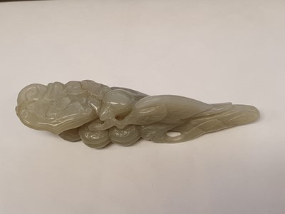 Lot 703 - A CHINESE PALE CELADON JADE 'BIRD AND LINGZHI' CARVING.
