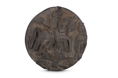 Lot 547 - AN INDO-PORTUGUESE CIRCULAR 'ST GEORGE AND THE DRAGON' SCHIST PANEL.