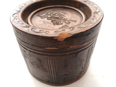 Lot 68 - A CHINESE YIXING ZISHA 'EIGHT IMMORTALS' TEA CADDY AND COVER.