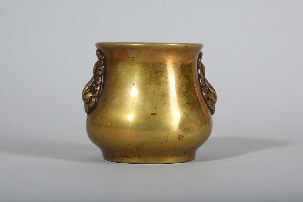 Lot 53 - A CHINESE TWIN HANDLED BRONZE INCENSE BURNER.