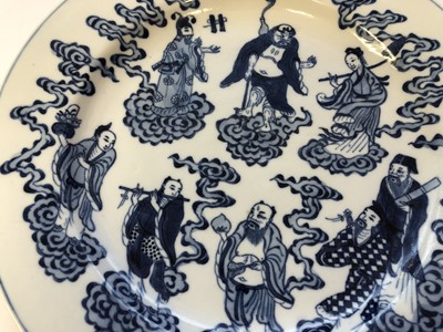 Lot 435 - A SET OF THREE CHINESE BLUE AND WHITE 'IMMORTALS' DISHES.