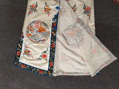 Lot 739 - THREE CHINESE EMBROIDERED SILK ROBES.