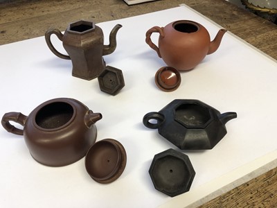 Lot 750 - FOUR CHINESE YIXING TEAPOTS AND COVERS.