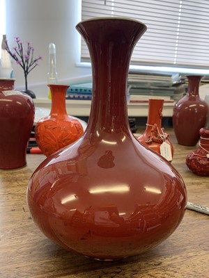 Lot 34 - A CHINESE COPPER RED-GLAZED BOTTLE VASE.