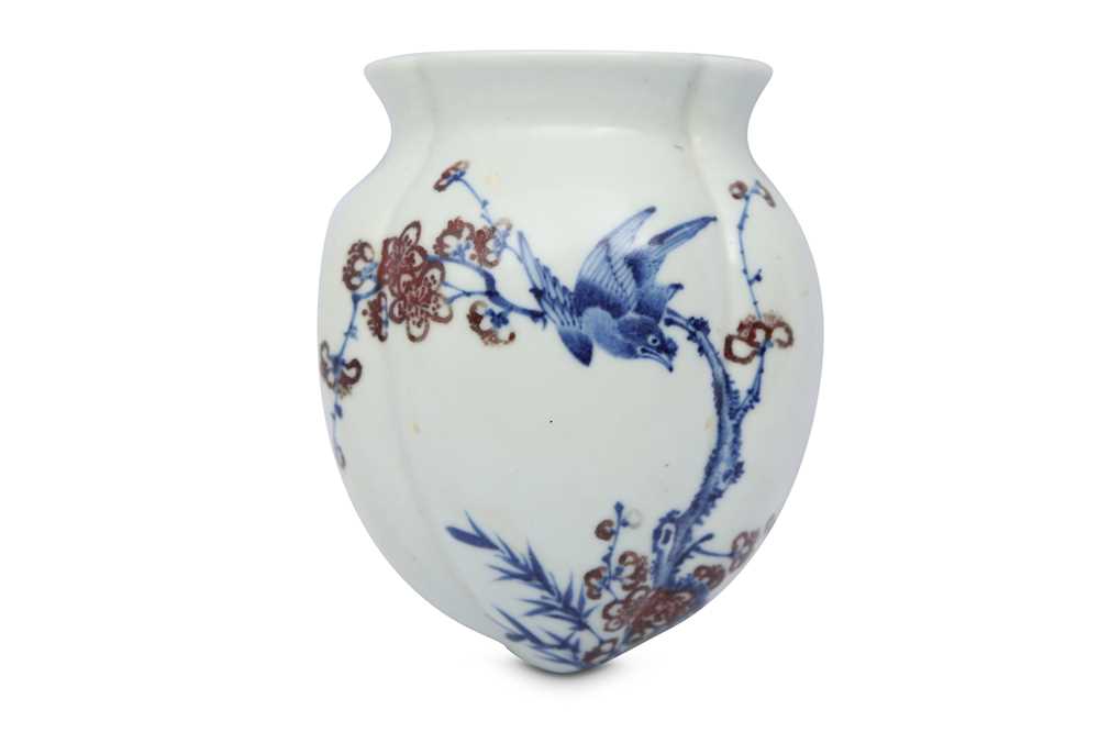 Lot 577 - A CHINESE BLUE AND WHITE AND UNDERGLAZE RED WALL VASE.
