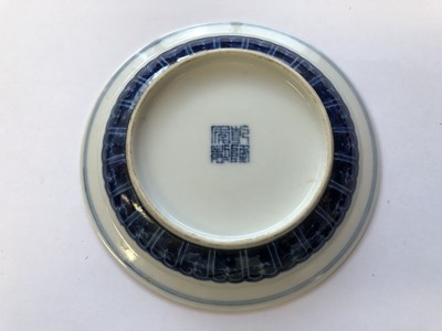 Lot 629 - A CHINESE BLUE AND WHITE 'DRAGON' CUP AND SAUCER.