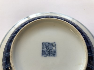 Lot 629 - A CHINESE BLUE AND WHITE 'DRAGON' CUP AND SAUCER.