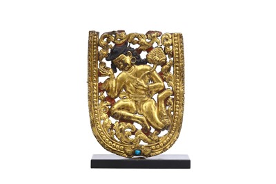 Lot 418 - A TIBETAN CHASED AND REPOUSSE PLAQUE OF A YOUTH.