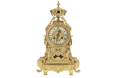 Lot 391 - A late 19th century French polished brass mantel clock