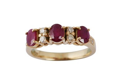 Lot 191 - A three stone ruby and diamond ring