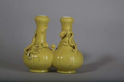 Lot 63 - A CHINESE YELLOW-GLAZED DOUBLE 'DRAGON' VASE.