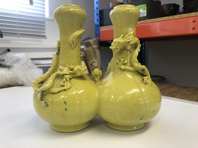 Lot 63 - A CHINESE YELLOW-GLAZED DOUBLE 'DRAGON' VASE.