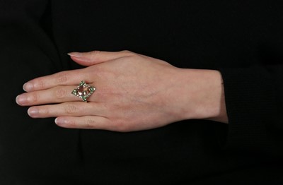 Lot 1221 - A morganite, green garnet and diamond dress ring