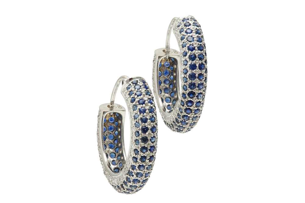 Lot 1257 - A pair of sapphire and diamond hoop earrings