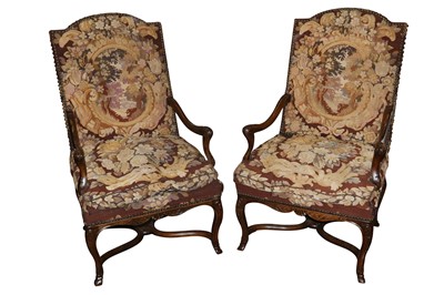 Lot 678 - A pair of mid 18th Century style carved mahogany open armchairs