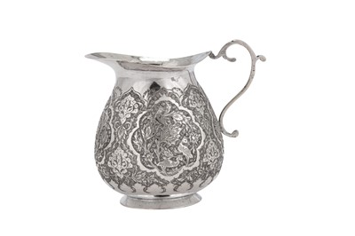 Lot 219 - A mid-20th century Iranian (Persian) silver milk jug, Isfahan circa 1940
