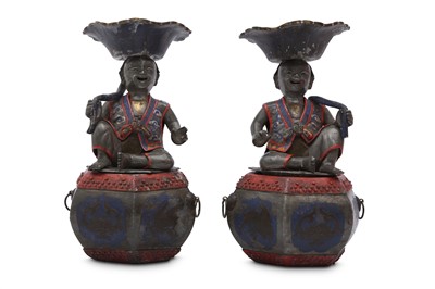 Lot 498 - A PAIR OF CHINESE PEWTER 'BOYS' CANDLE HOLDERS.