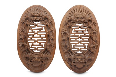 Lot 604 - A PAIR OF WOOD CARVED OVAL PANELS.