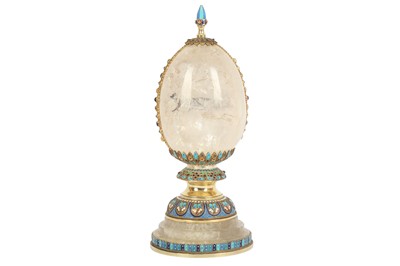 Lot 536 - A late 20th / early 21st century rock crystal style and enamel egg ornament