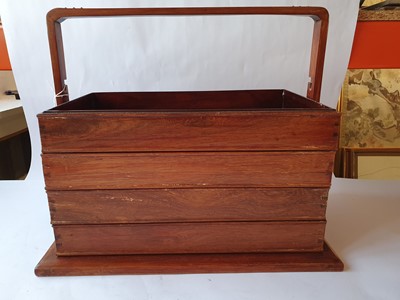 Lot 253 - A CHINESE WOOD TIERED PICNIC BOX.