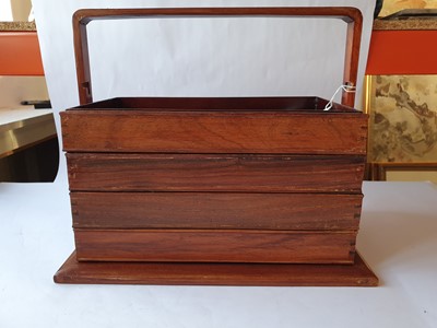 Lot 253 - A CHINESE WOOD TIERED PICNIC BOX.